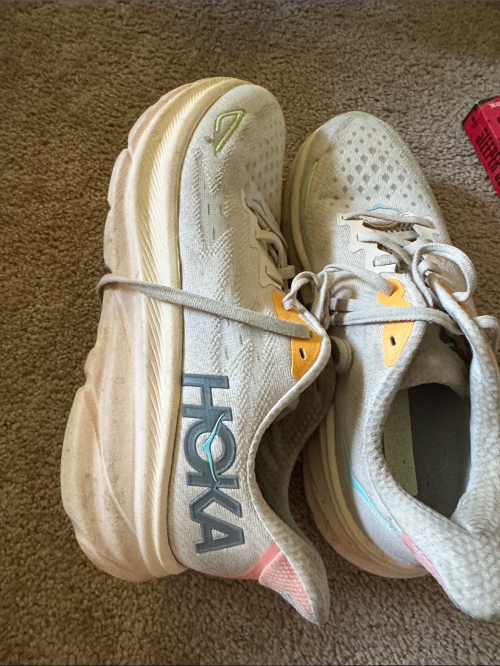 Hoka one women’s  White Running Shoes with Yellow Accents Clifton 9